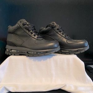 Brand new, never worn. Nike black leather boots. Boys size 6.